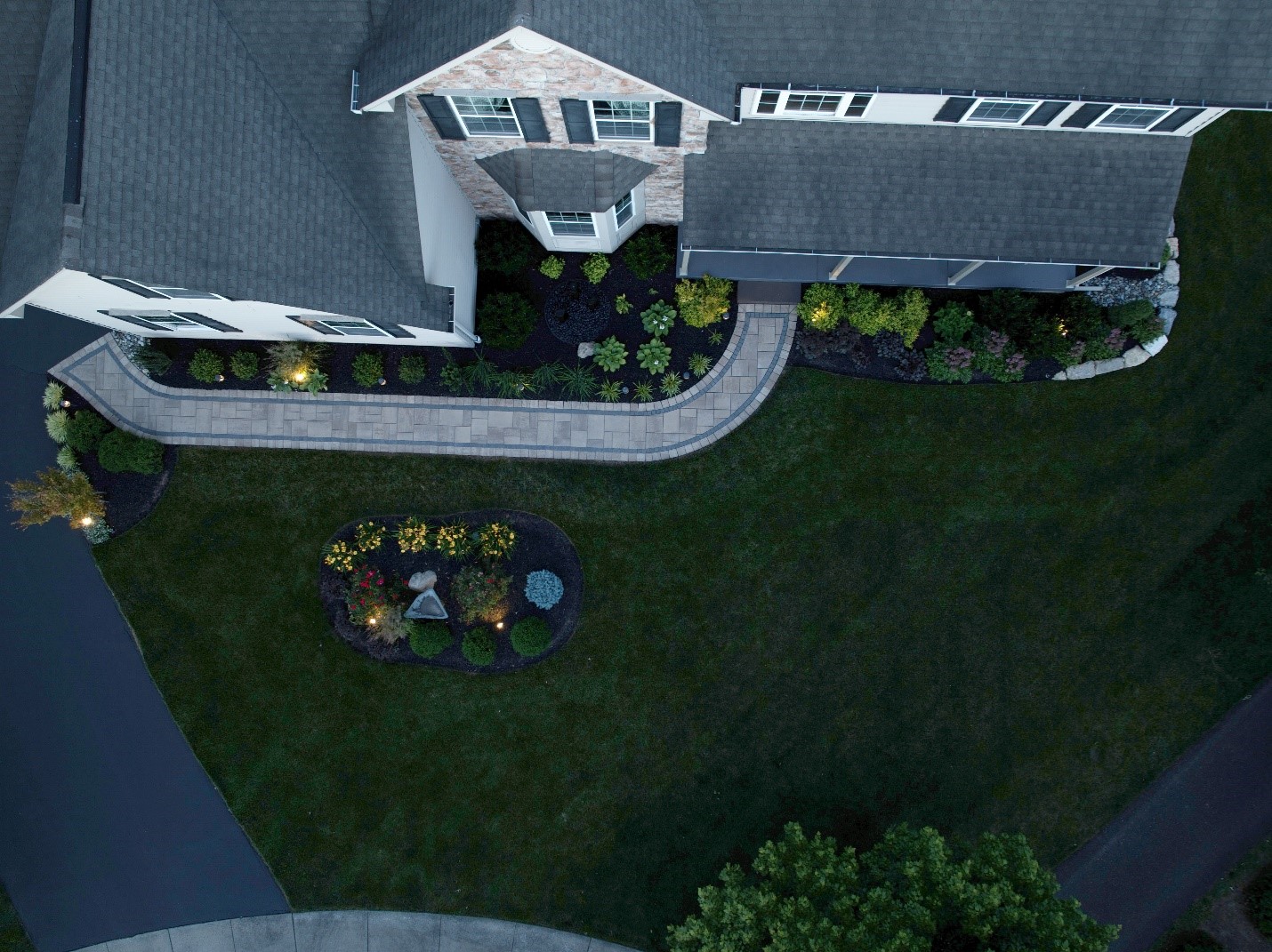 An aerial view of pavers installed on a large property.